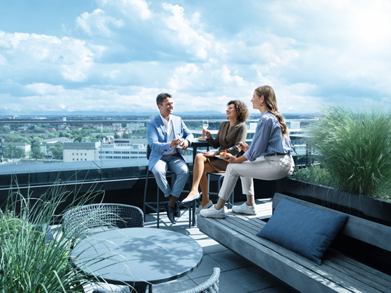 Phlebology A man and two women are on a rooftop terrace wearing compression stockings.A man and two women are on a rooftop terrace wearing compression stockings.