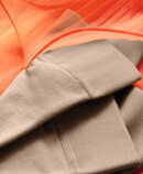 Juzo Inspiration tights lie on an orange tulle Dress