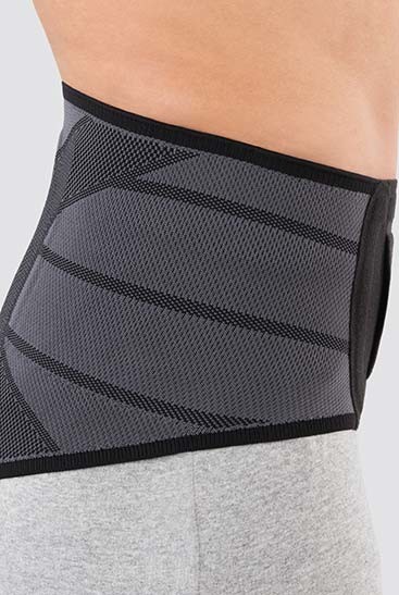 3rd product image Side view Person wearing JuzoPro Lumbal Light, side view