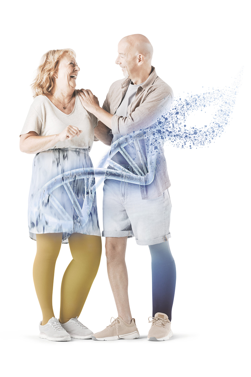 Two people smiling at each other. In the foreground, a diagram of DNA Two people smiling at each other. In the foreground, a diagram of DNA