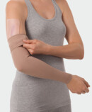 Juzo ScarPad, in combination with compression on the arm Woman using Juzo ScarPad on the arm