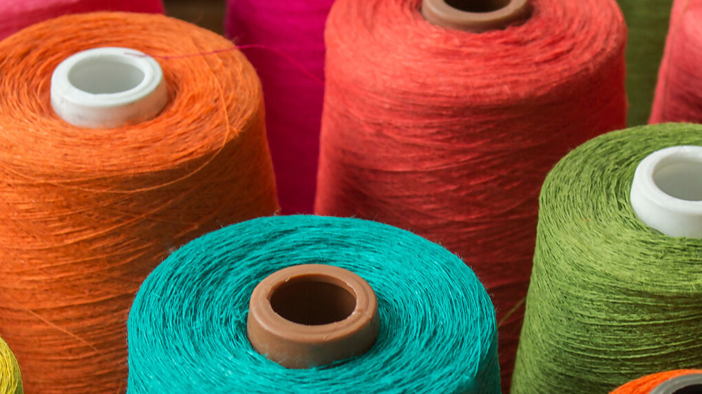 Bobbins with different coloured threads